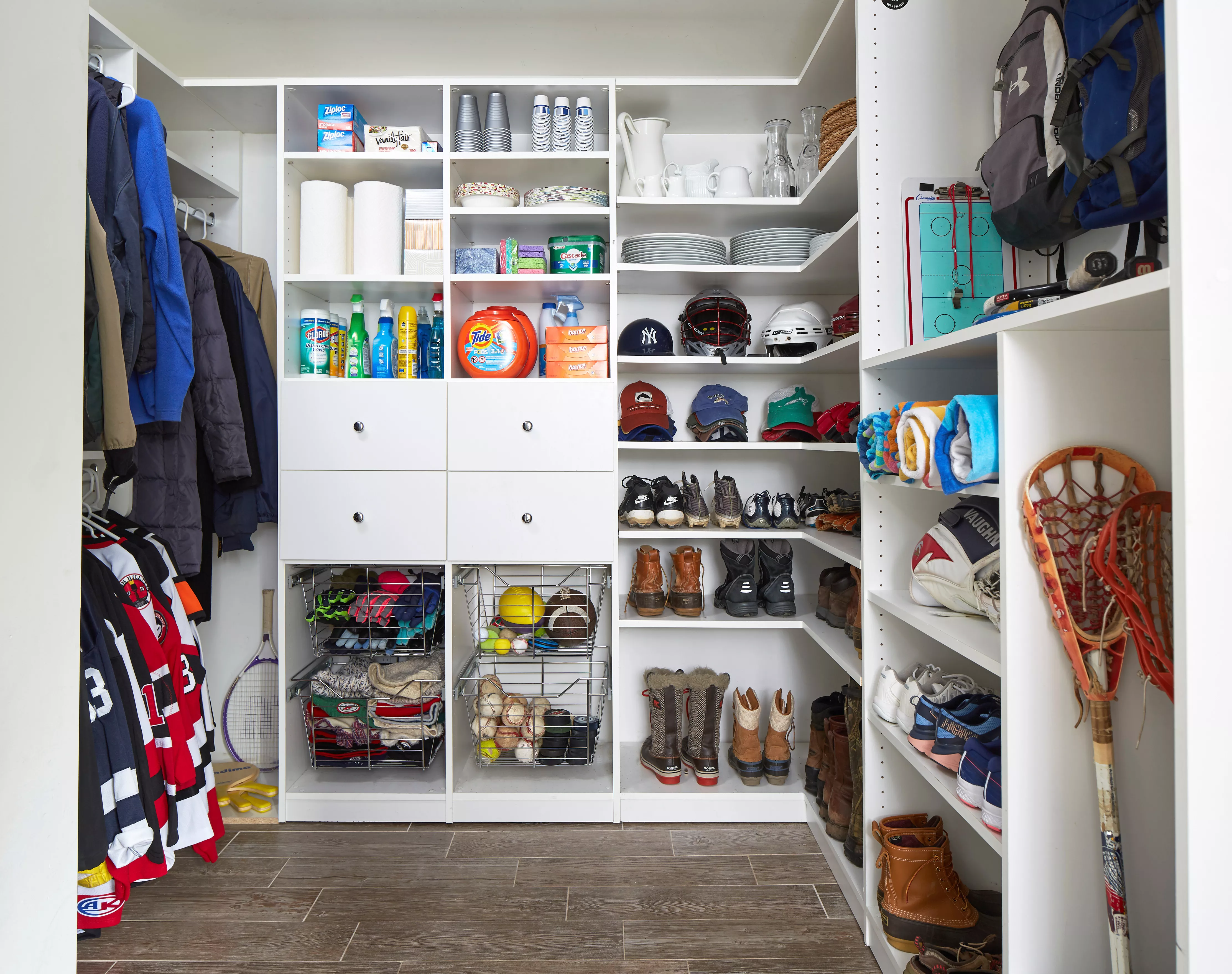 organized closet mudroom shelves with shoes coats and supplies