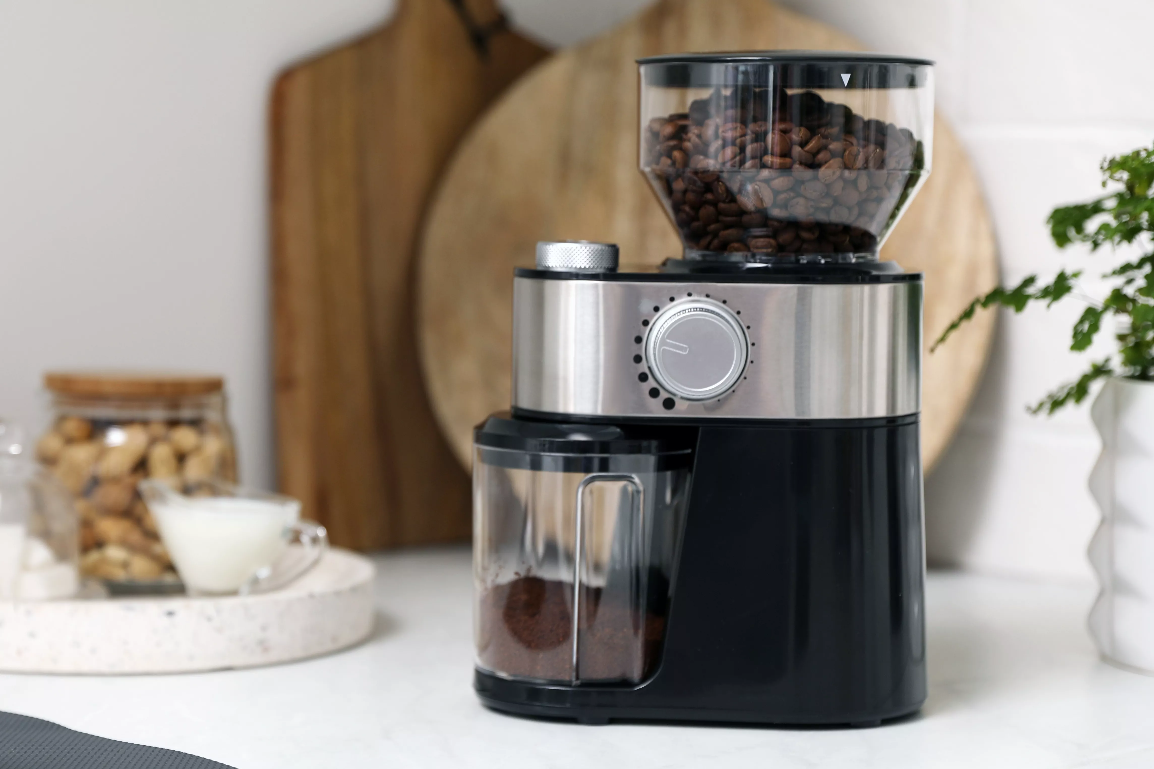 coffee grinder in kitchen with white tile