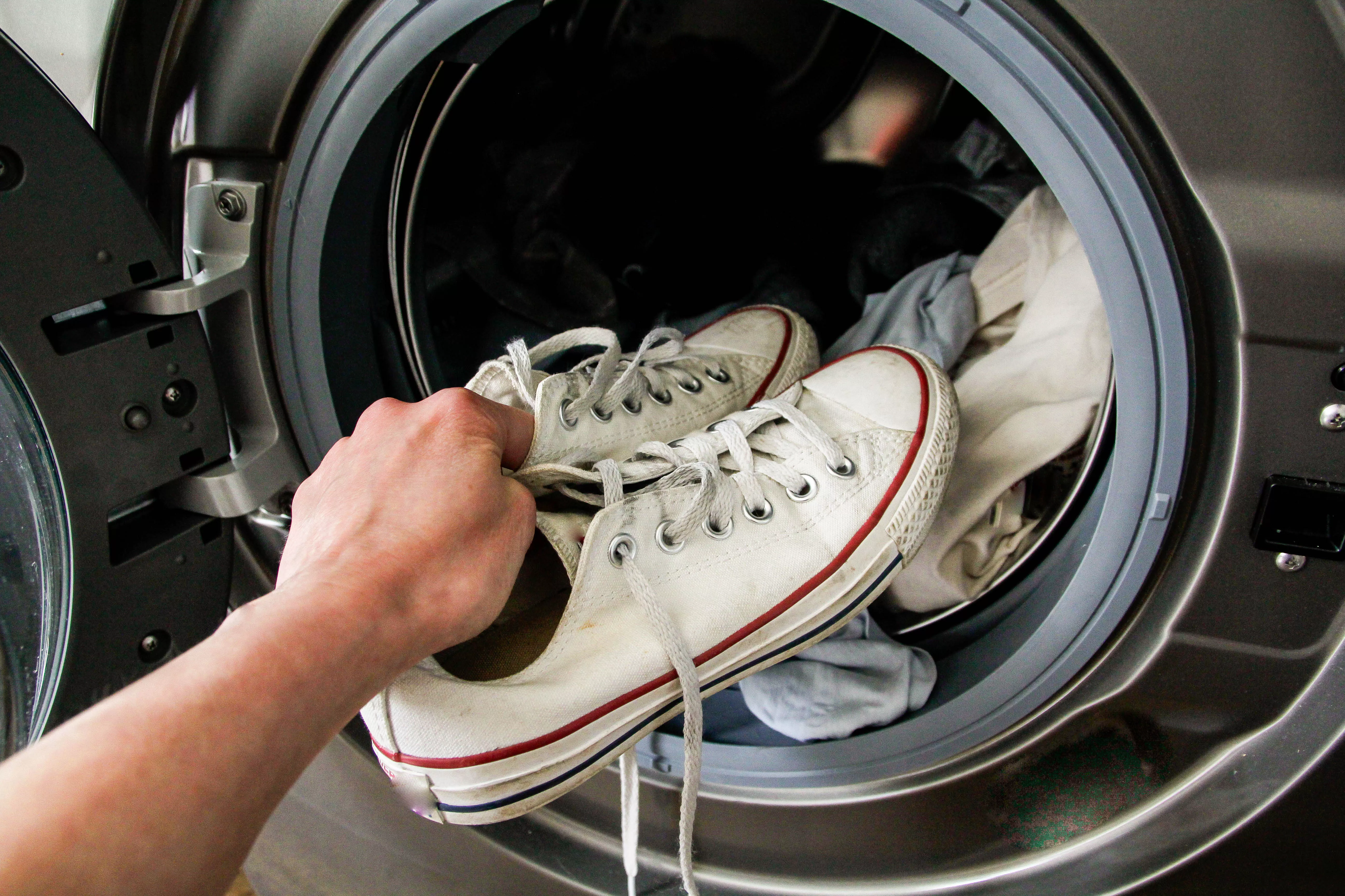 putting white shoes into the dryer