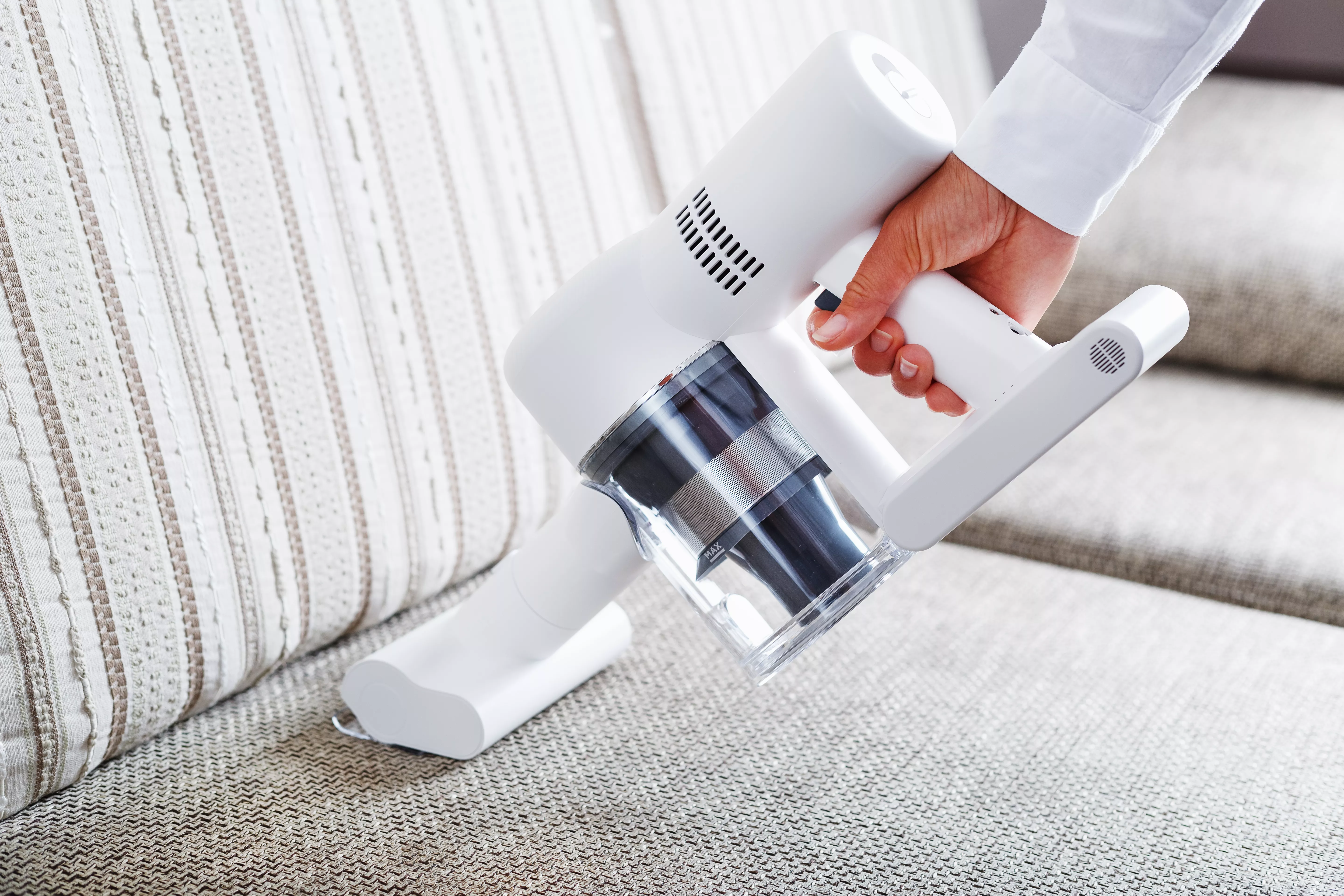 hand vacuum cleaning sofa cushions