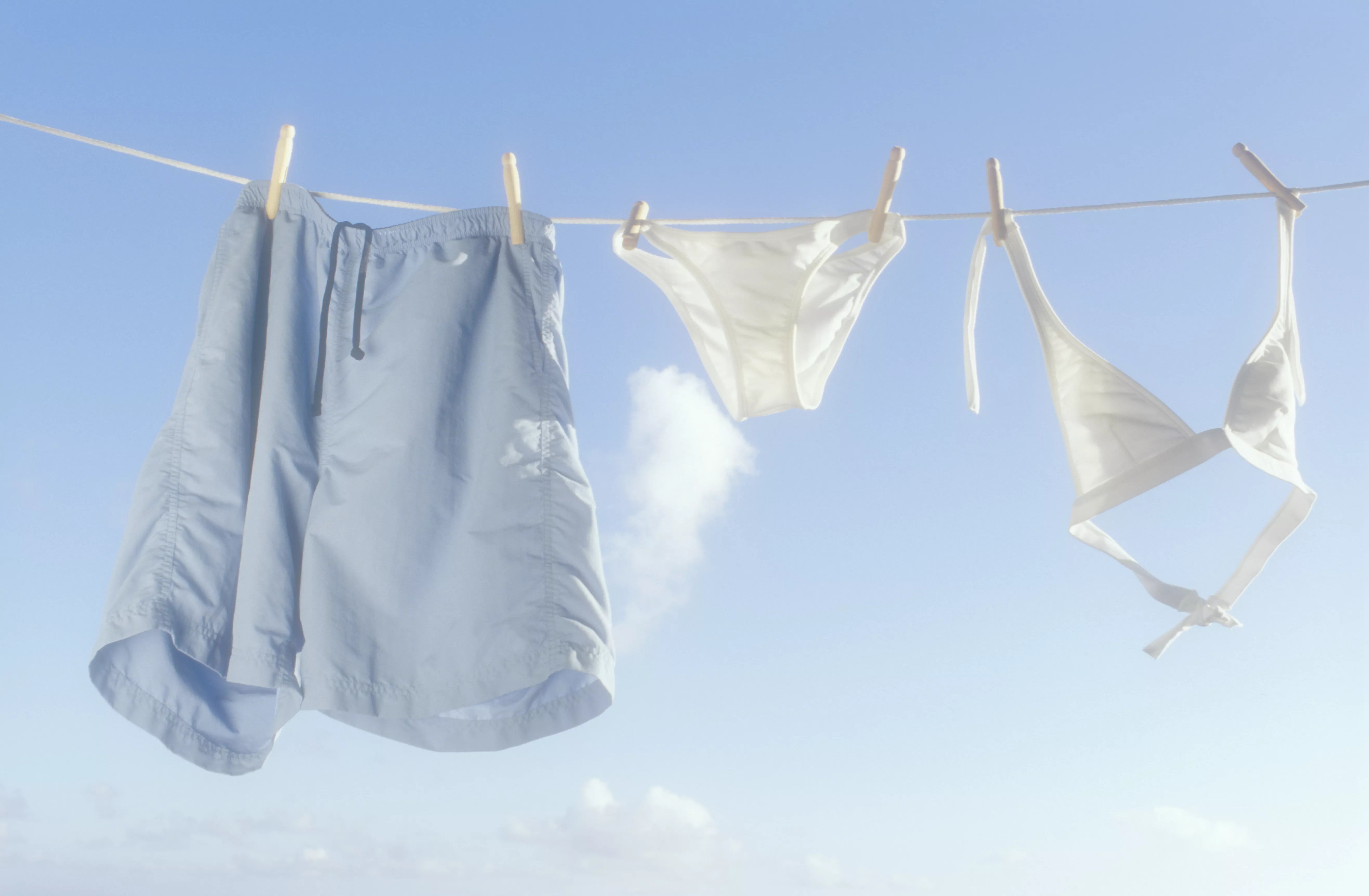 swimsuits drying on a line